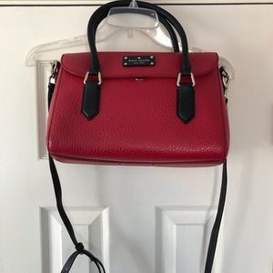 Kate Spade lg satchel red with black trim.